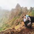 Santo Antao Island, Cape Verde. Hiking outdoor activity. Male traveler photographing mountain peaks in surreal Xo Xo valley