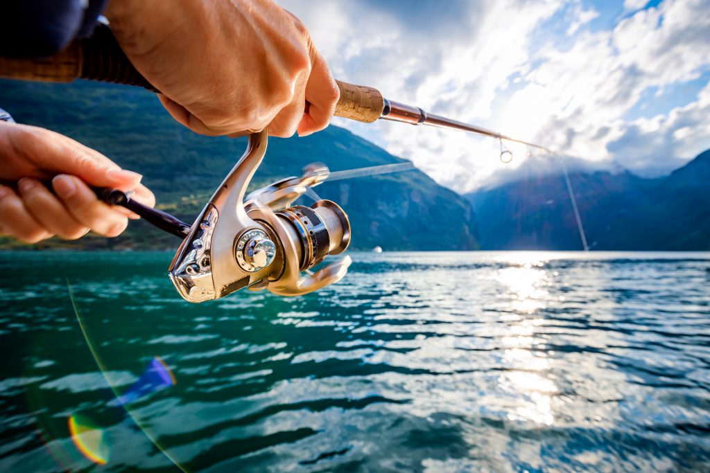 Woman fishing on Fishing rod spinning